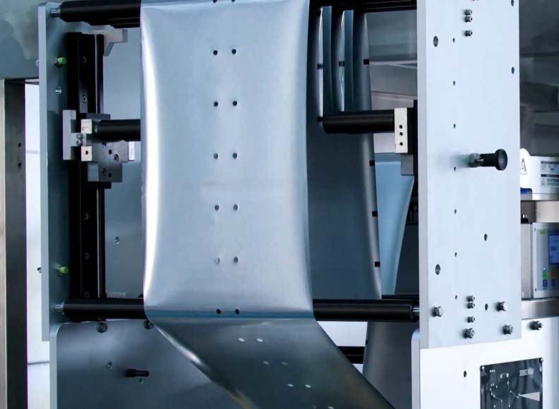 Horizontal pouch forming film feed and web control mechanism