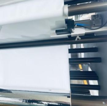 Roll stock pouch machine film unwind and tension control path