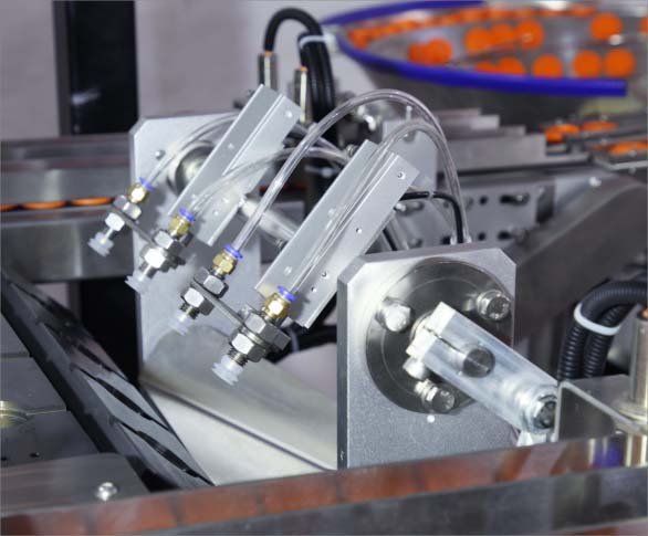 Pneumatic pre-cut lid pickup and placement detail