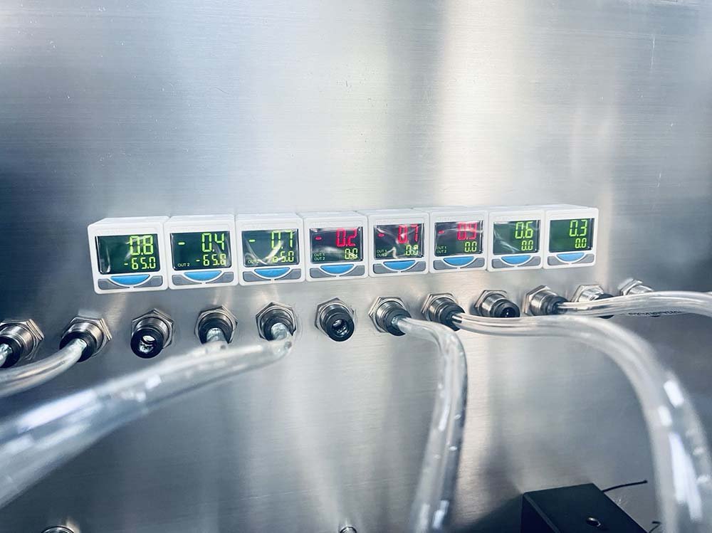 Digital vacuum monitoring sensors on an SG series pouch opening system