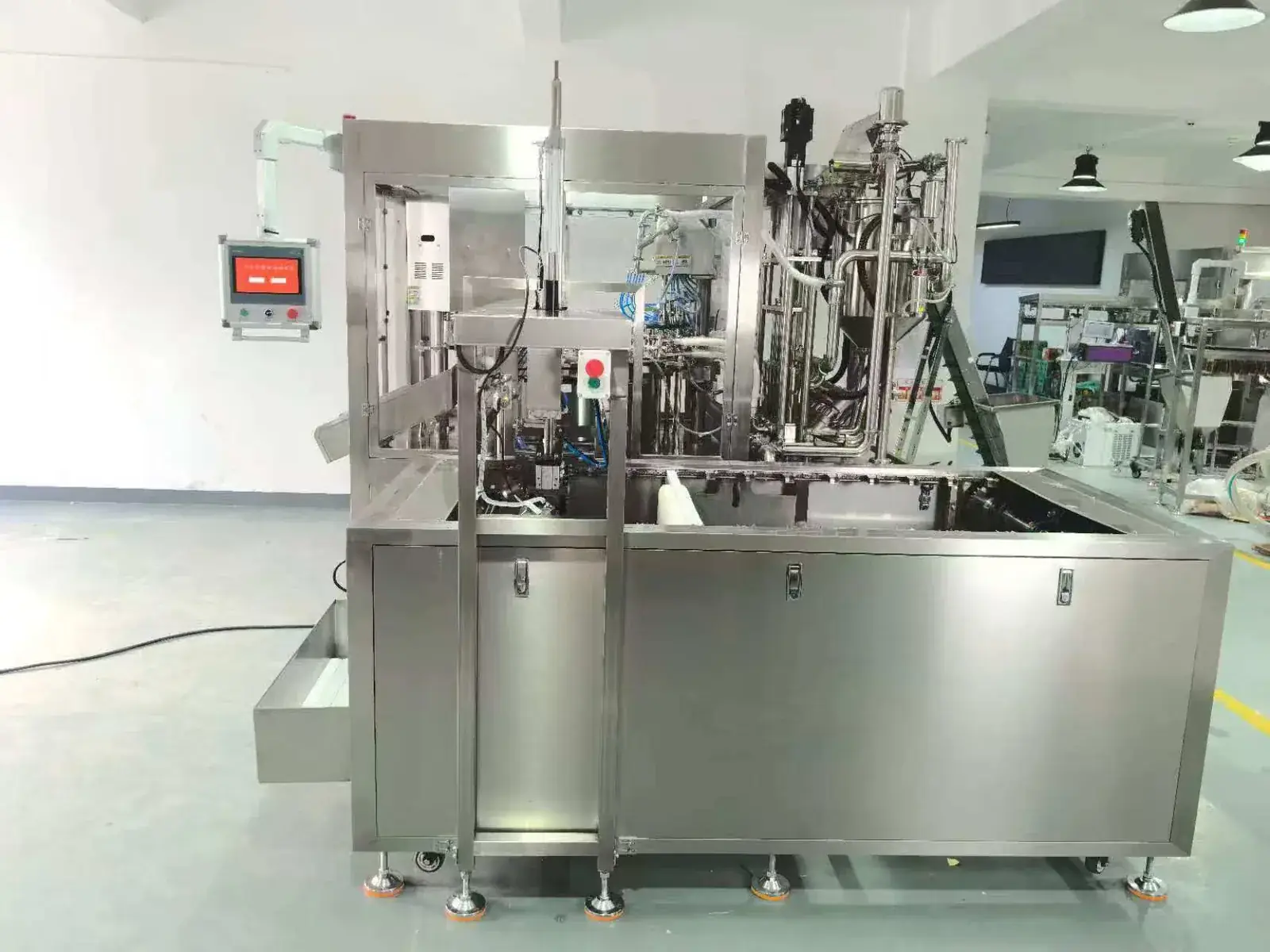 Premade spout pouch filling machine reference showing controls and turntable