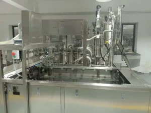Filling and capping stations on a premade spout pouch machine